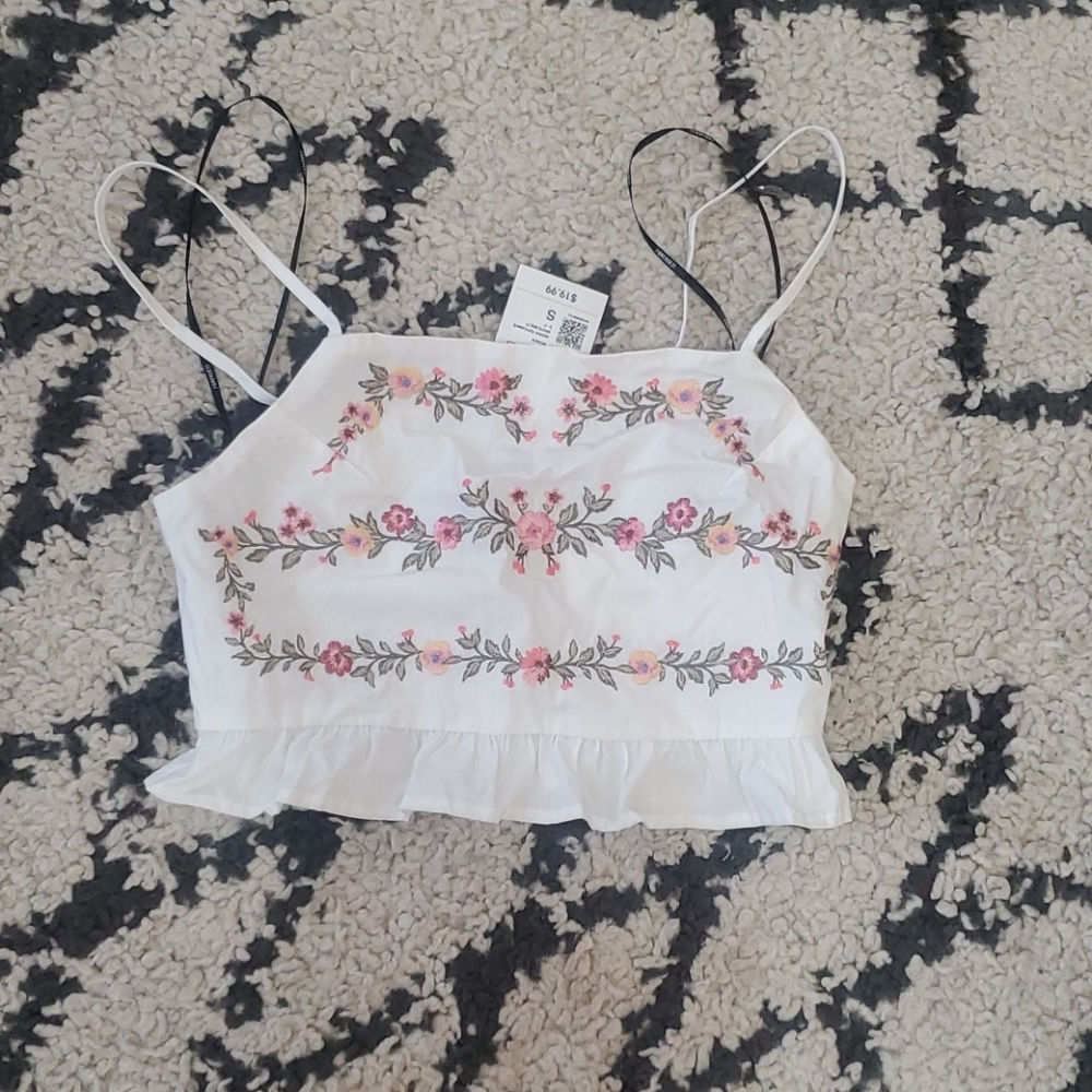 White woven top with embroidered flowers